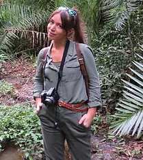 a female in the jungle poses for the camera